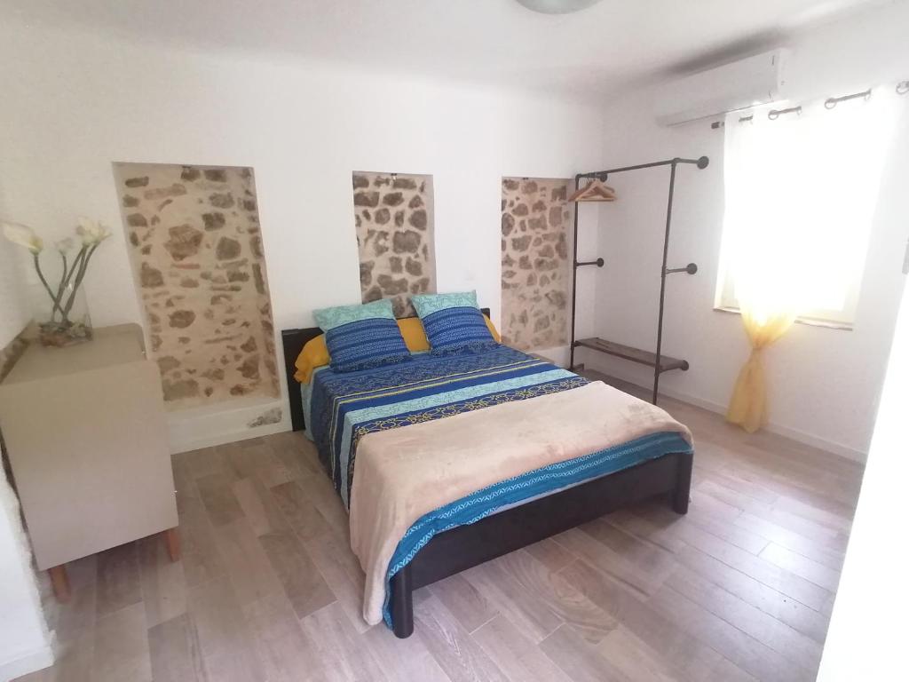 Postel nebo postele na pokoji v ubytování Gîte et chambres d'hôtes Les 2 Pins