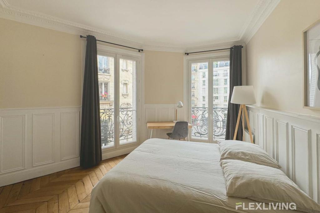 En eller flere senge i et værelse på Flexliving - Room - Lamarck