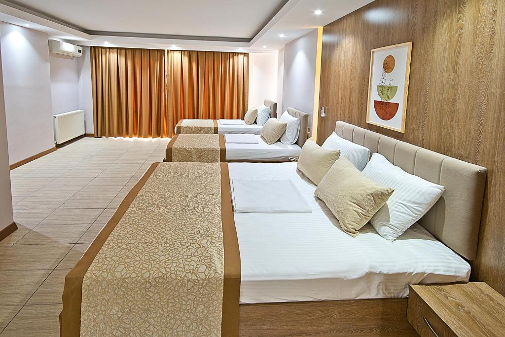 Lion City Hotel - Deluxe Dreibettzimmer