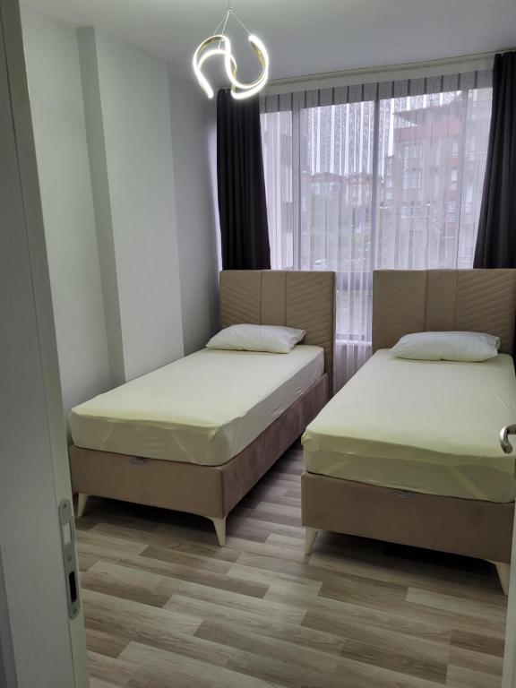 Postel nebo postele na pokoji v ubytování MUKKA TURIZIM AMAÇLI Daireler