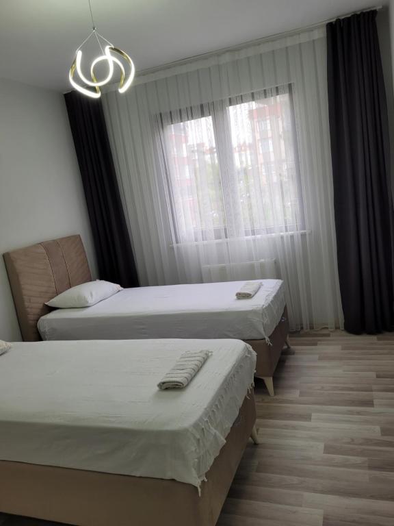 Postel nebo postele na pokoji v ubytování MUKKA TURIZIM AMAÇLI Daireler