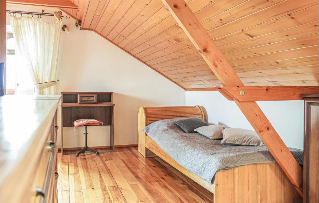 Postel nebo postele na pokoji v ubytování Two-Bedroom Holiday Home In Lidzbark Warminski