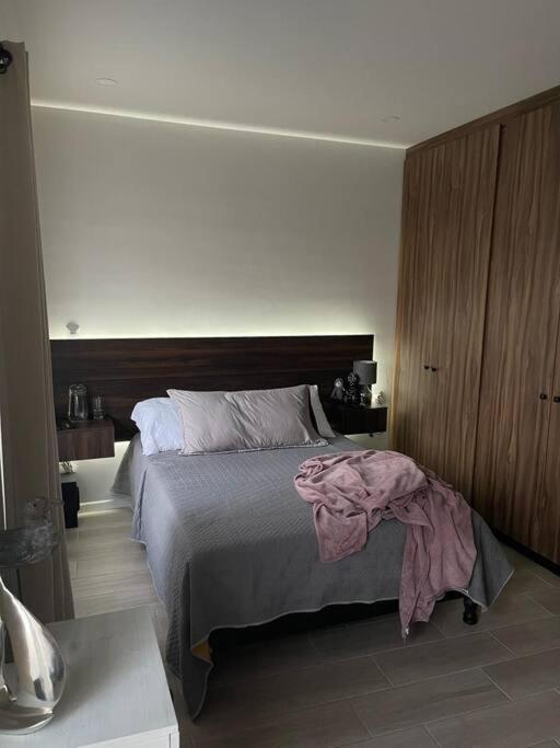 Una cama o camas en una habitación de Casa Lupita - Centro
