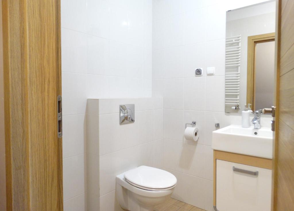 Kúpeľňa v ubytovaní Apartamenty Miku