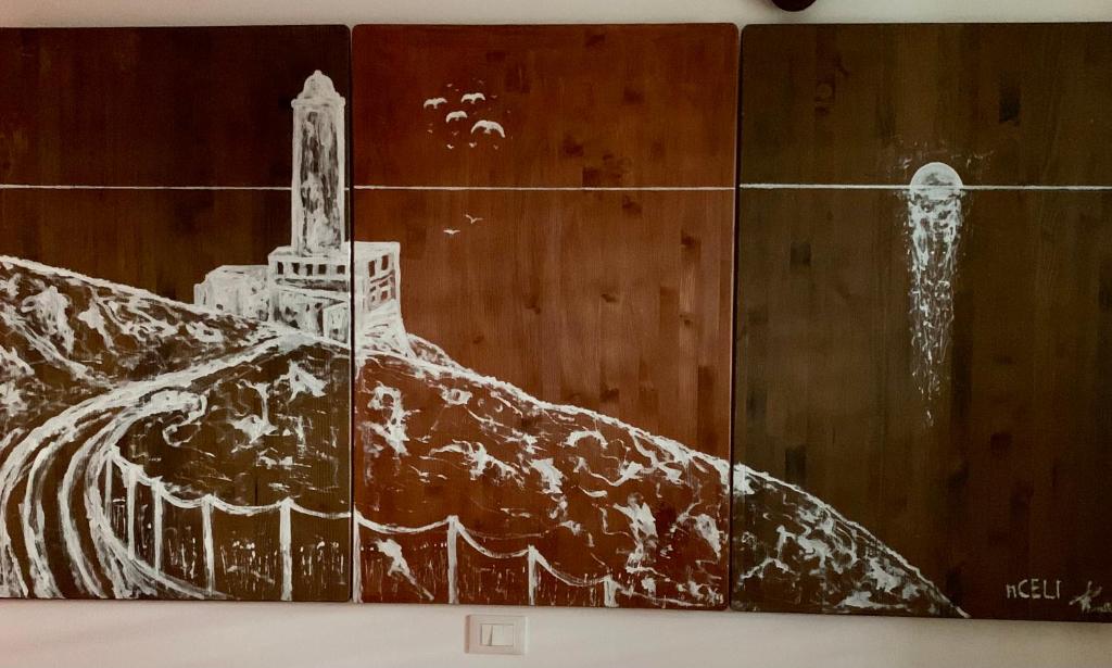 a painting of a building on a wall at n CELI in Uggiano la Chiesa