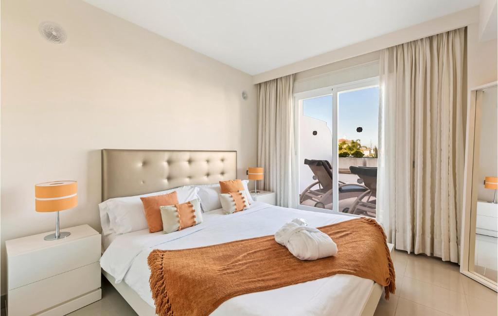 A bed or beds in a room at Beautiful Apartment In Estepona