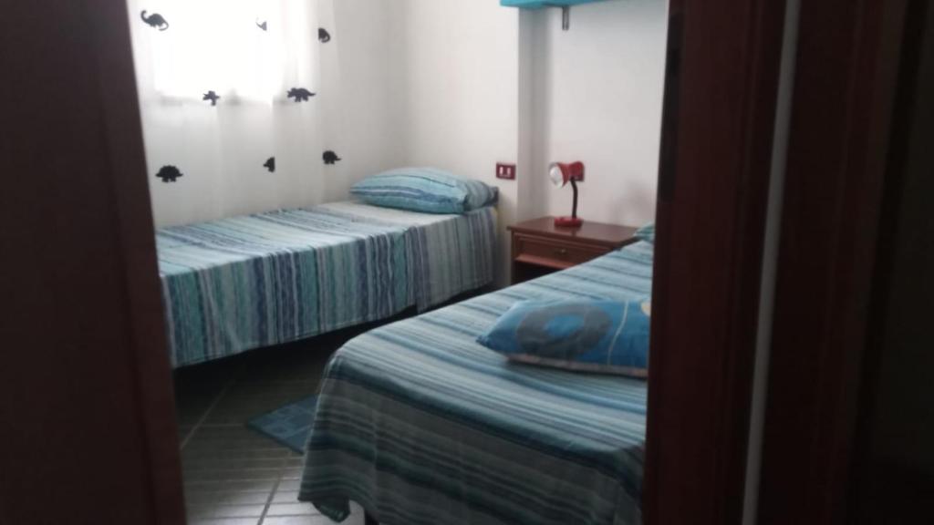 Posteľ alebo postele v izbe v ubytovaní Casa Leonardo