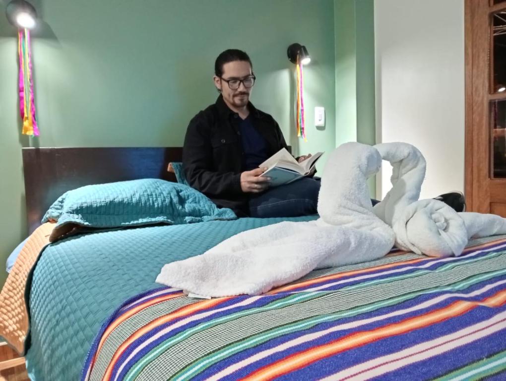 Postel nebo postele na pokoji v ubytování Hotel Incas Suite, con Aguas Termomedicinales