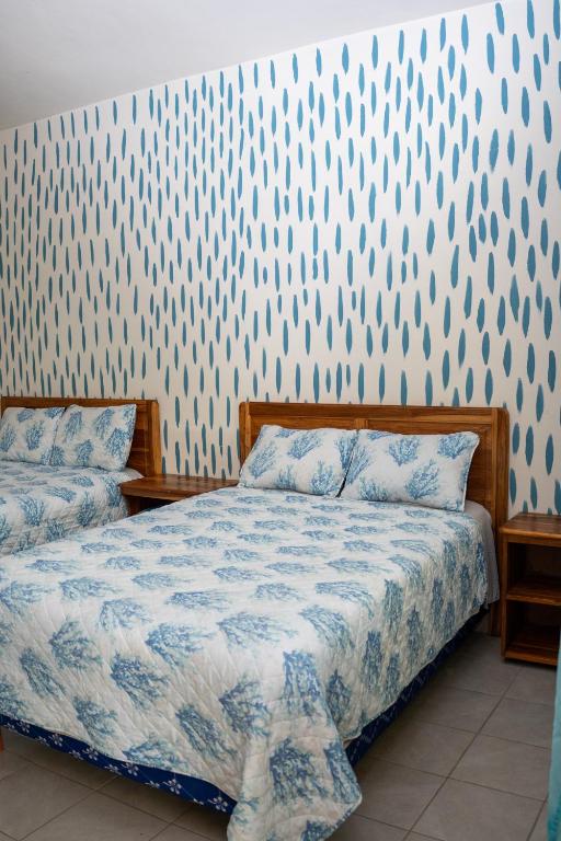 Postel nebo postele na pokoji v ubytování Hotel Viña del Mar Omoa