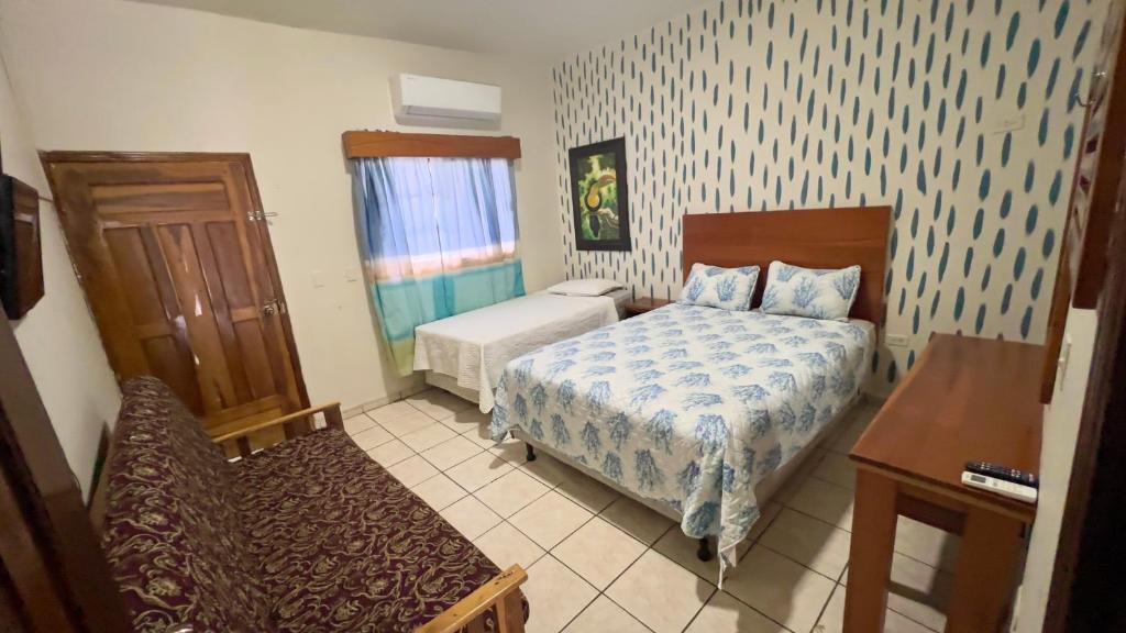 Postel nebo postele na pokoji v ubytování Hotel Viña del Mar Omoa