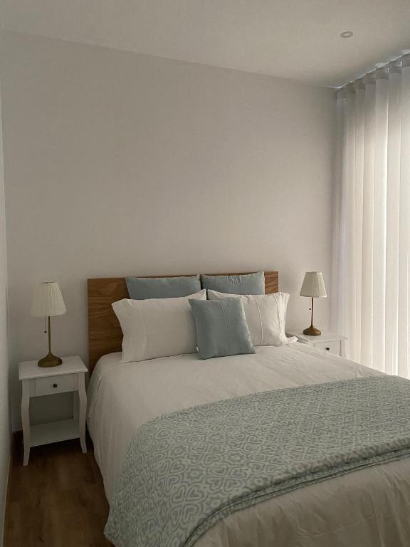 Postel nebo postele na pokoji v ubytování CASA DAS QUINTÃES