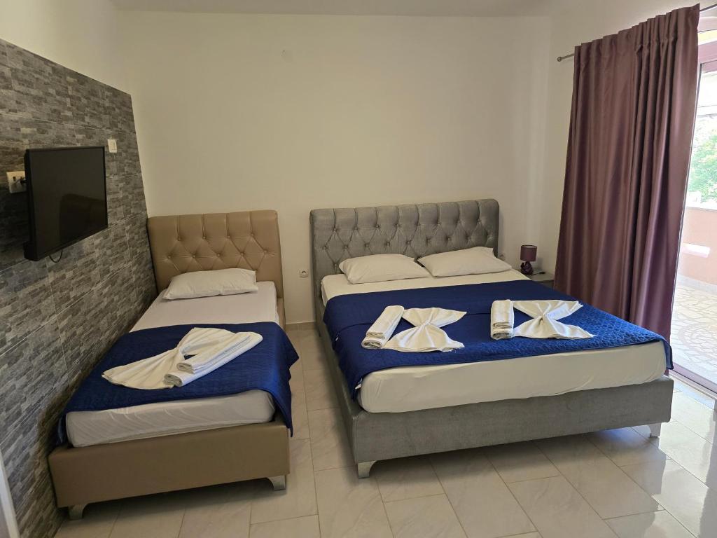 Postel nebo postele na pokoji v ubytování Vila Cattleya