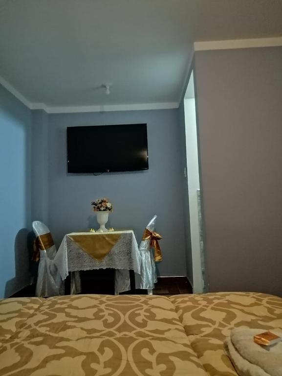 Postel nebo postele na pokoji v ubytování Hotel Incas Suite, con Aguas Termomedicinales