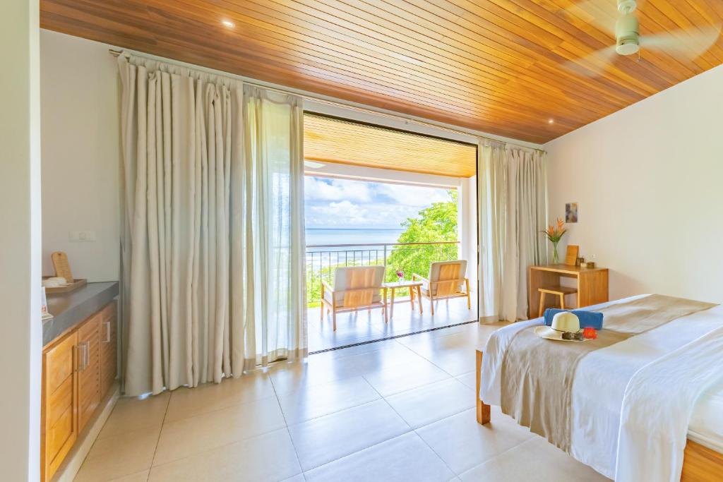 Postel nebo postele na pokoji v ubytování Hotel Boutique Lagarta Lodge