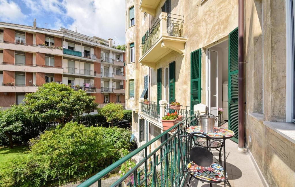 a balcony of a building with a table and chairs at Casa Maria Paola in Santa Margherita Ligure