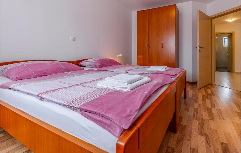 Łóżko lub łóżka w pokoju w obiekcie Apartment Medulin 04