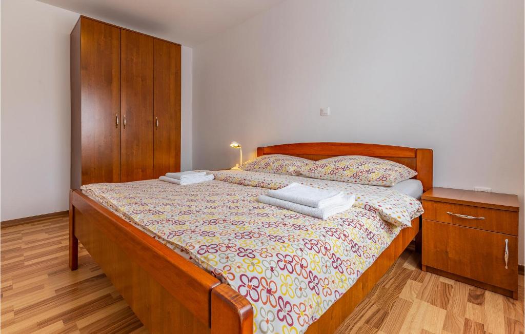 Łóżko lub łóżka w pokoju w obiekcie Apartment Medulin 04