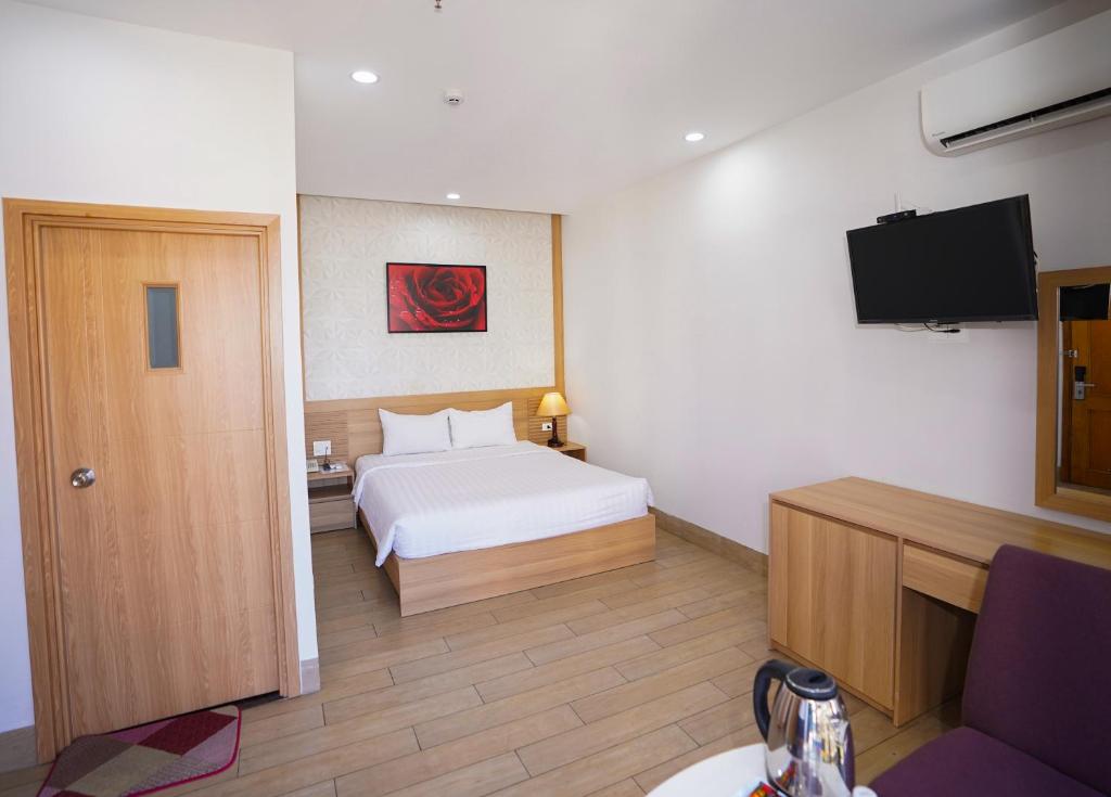 Postel nebo postele na pokoji v ubytování An Dương Hotel & Apartment