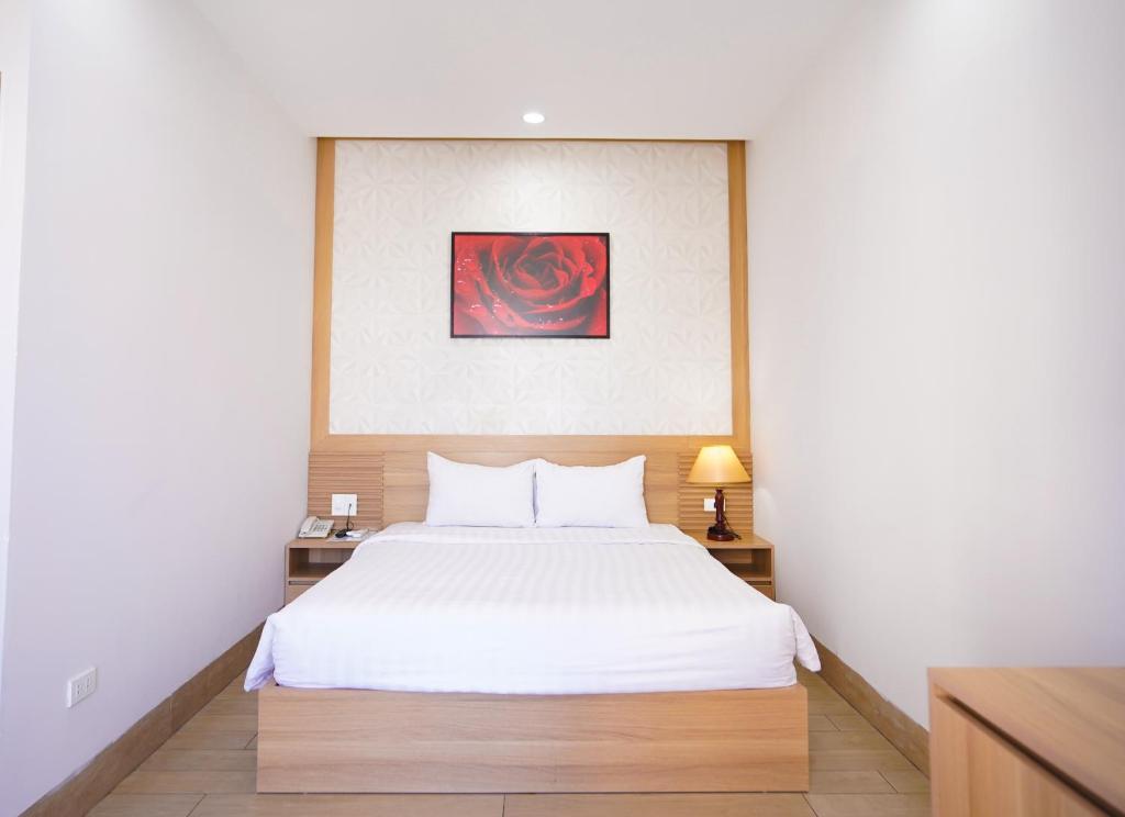 Postel nebo postele na pokoji v ubytování An Dương Hotel & Apartment