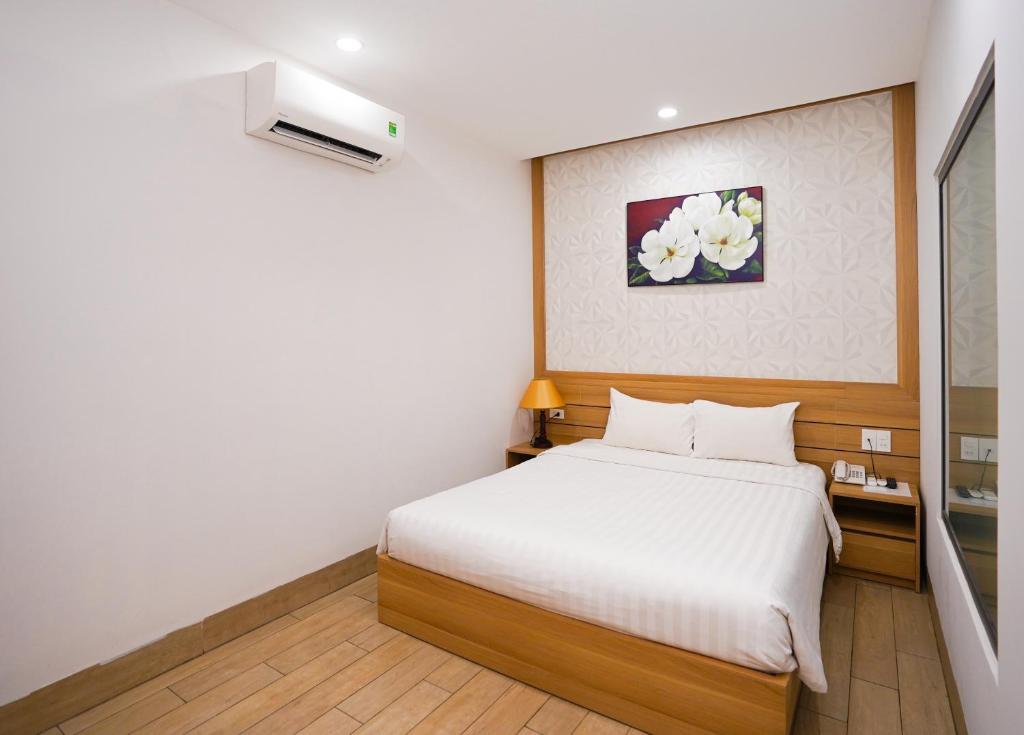 Postel nebo postele na pokoji v ubytování An Dương Hotel & Apartment