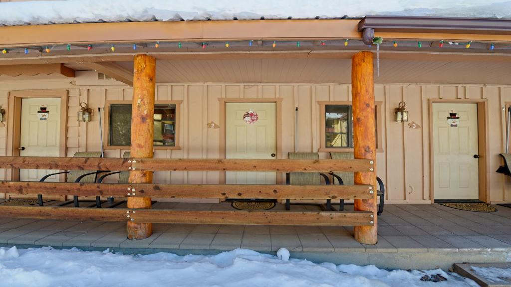 a covered porch of a building with a bench at Arrowhead 02 in Red River