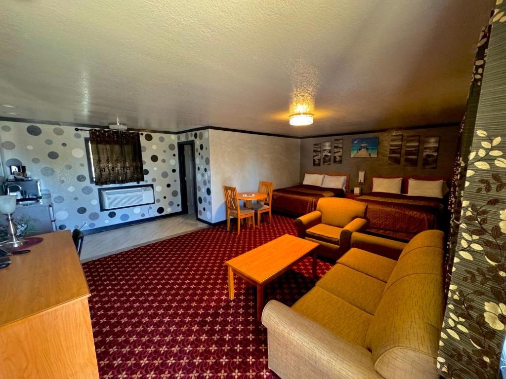 a living room with a couch and a table at Cascade Lodge in Bend