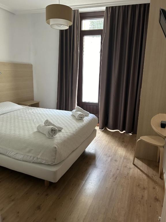 Postel nebo postele na pokoji v ubytování Casa OTANO