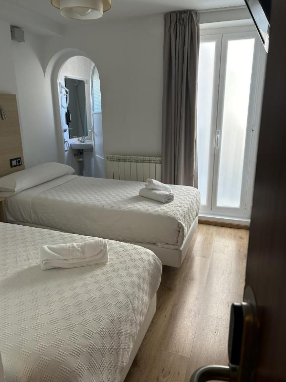 Postel nebo postele na pokoji v ubytování Casa OTANO