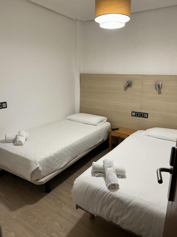 Postel nebo postele na pokoji v ubytování Casa OTANO