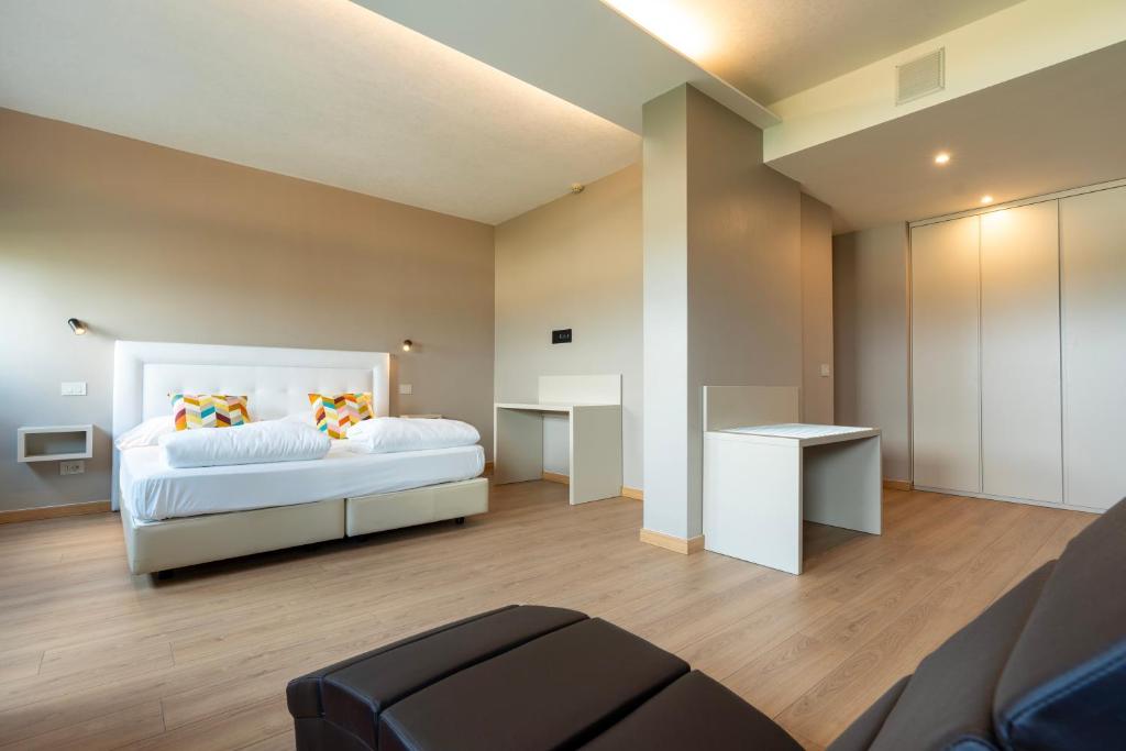Voodi või voodid majutusasutuse Hotel Saccardi & Spa - Adults Only toas