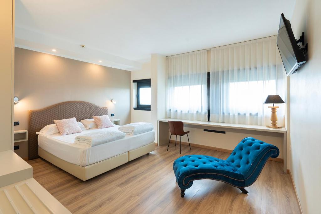 Voodi või voodid majutusasutuse Hotel Saccardi & Spa - Adults Only toas