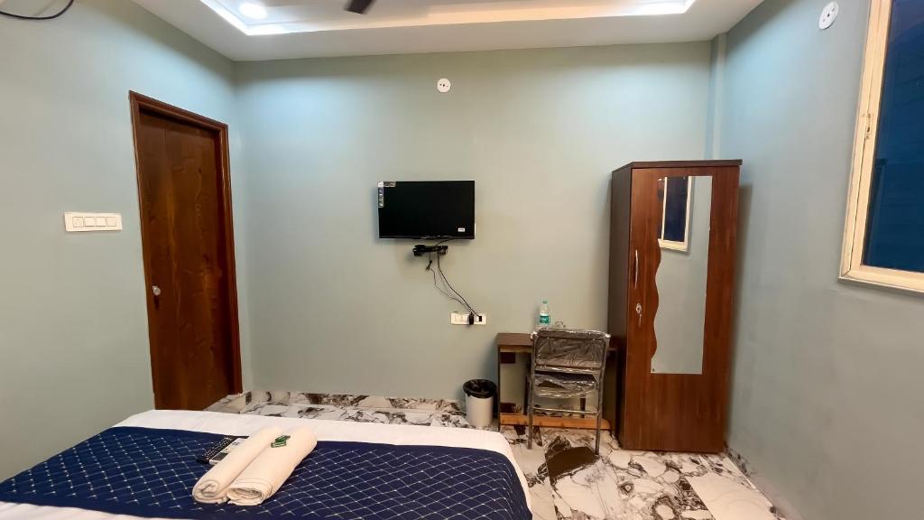 Postel nebo postele na pokoji v ubytování Hotel Abhinanadan