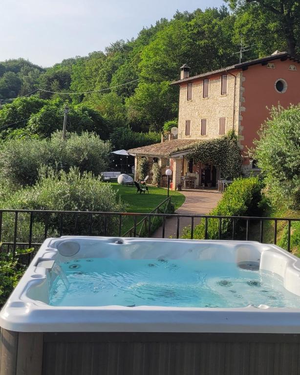 a hot tub on the balcony of a house at B&B L'Usignolo in Ascoli Piceno