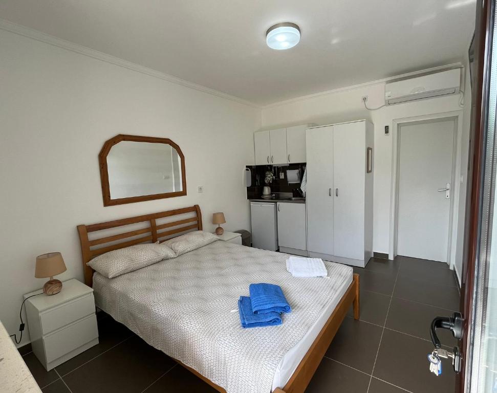 Postel nebo postele na pokoji v ubytování Apartments Simba