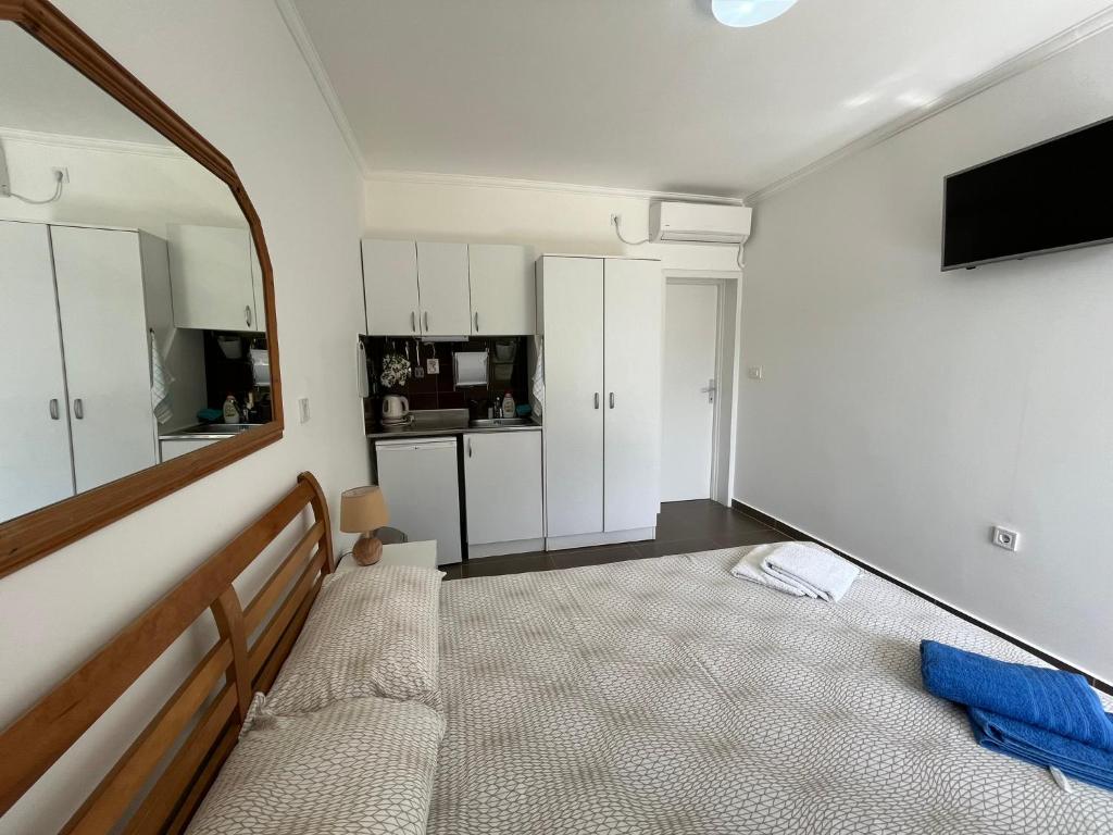 Postel nebo postele na pokoji v ubytování Apartments Simba
