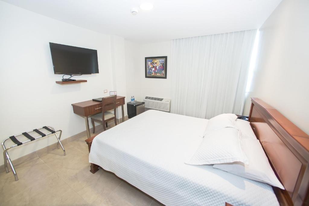 Postel nebo postele na pokoji v ubytování Hotel Marcelius