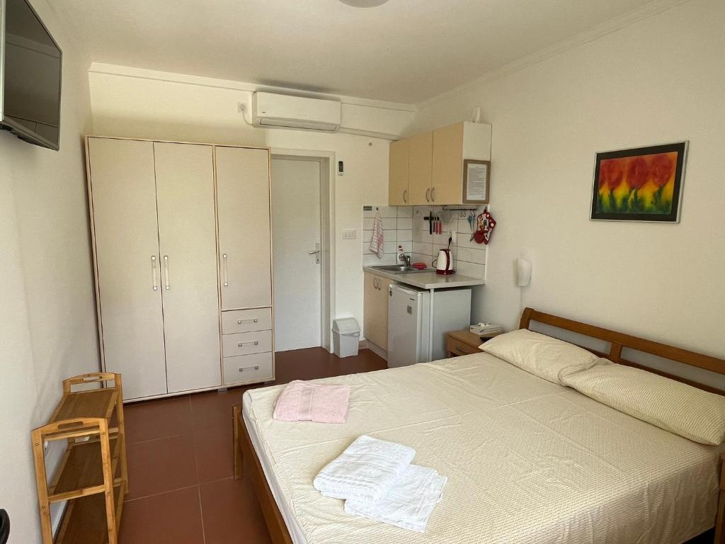Postel nebo postele na pokoji v ubytování Apartments Simba