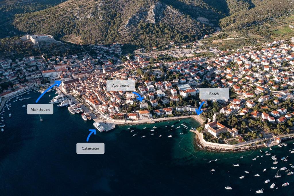 an aerial view of a city with boats in the water at Up&Above ,New Luxury Apt, Steps from Beach and Old Town in Hvar
