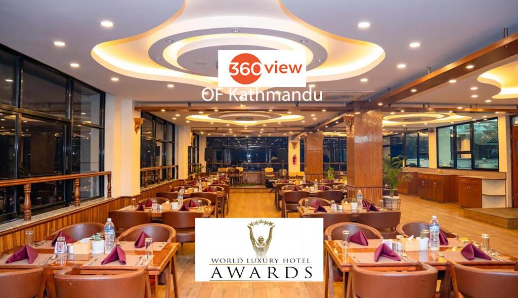 a restaurant at the restaurant of kyrmandu awaits meals at Drishya Hotel in Kathmandu
