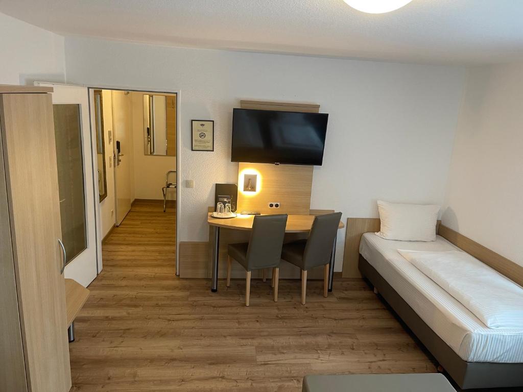 Postel nebo postele na pokoji v ubytování Hafner Hotel Apartment Self Check-In Anytime