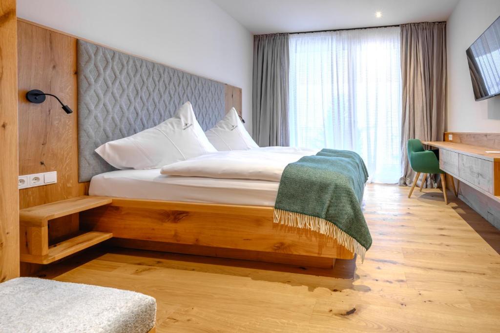 Posteľ alebo postele v izbe v ubytovaní Das Hillside Maria Alm Hintermoos
