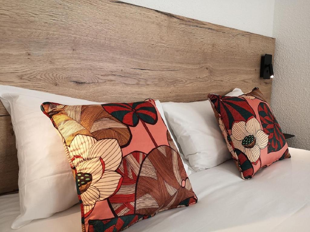 Postel nebo postele na pokoji v ubytování Hotel Les Mésanges
