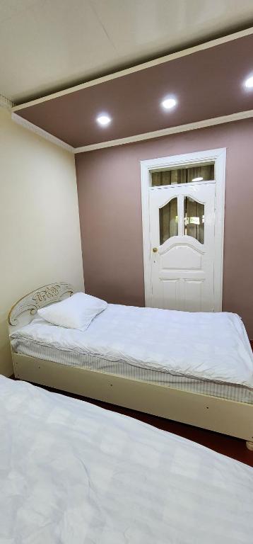 Postel nebo postele na pokoji v ubytování Sim-Sim Hostel