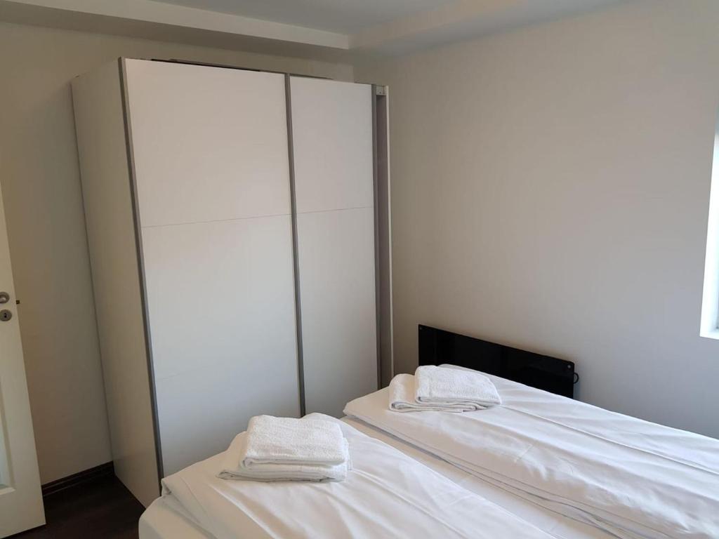 Postel nebo postele na pokoji v ubytování Lagunen Apartments