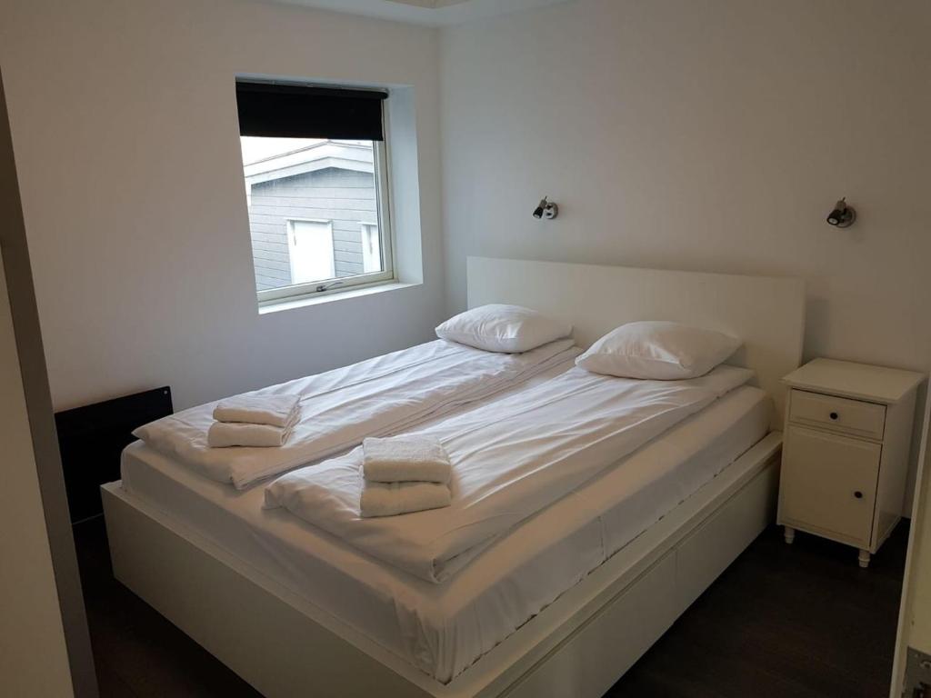 Postel nebo postele na pokoji v ubytování Lagunen Apartments