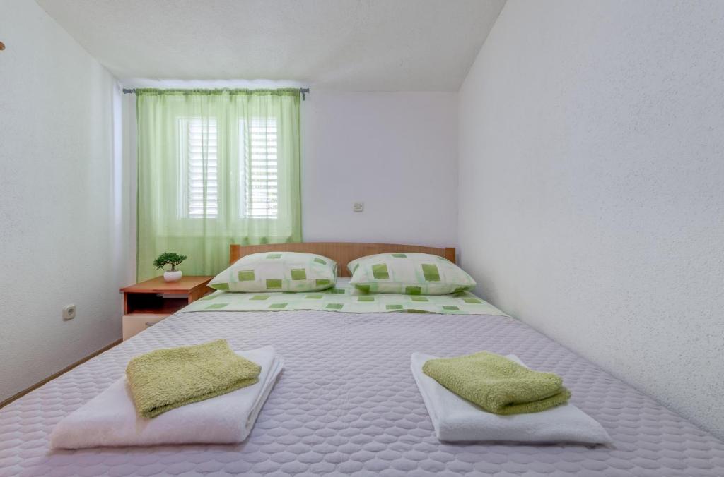 Postel nebo postele na pokoji v ubytování Apartment Nina
