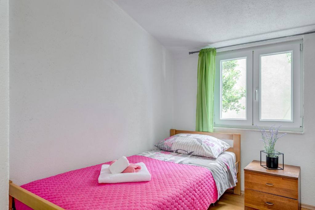 Postel nebo postele na pokoji v ubytování Apartment Nina