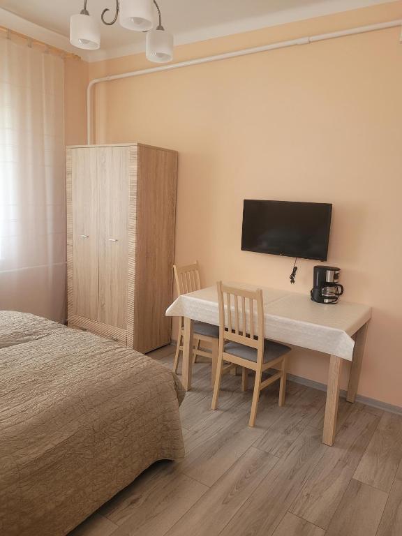 Postel nebo postele na pokoji v ubytování AZTA central Apartments