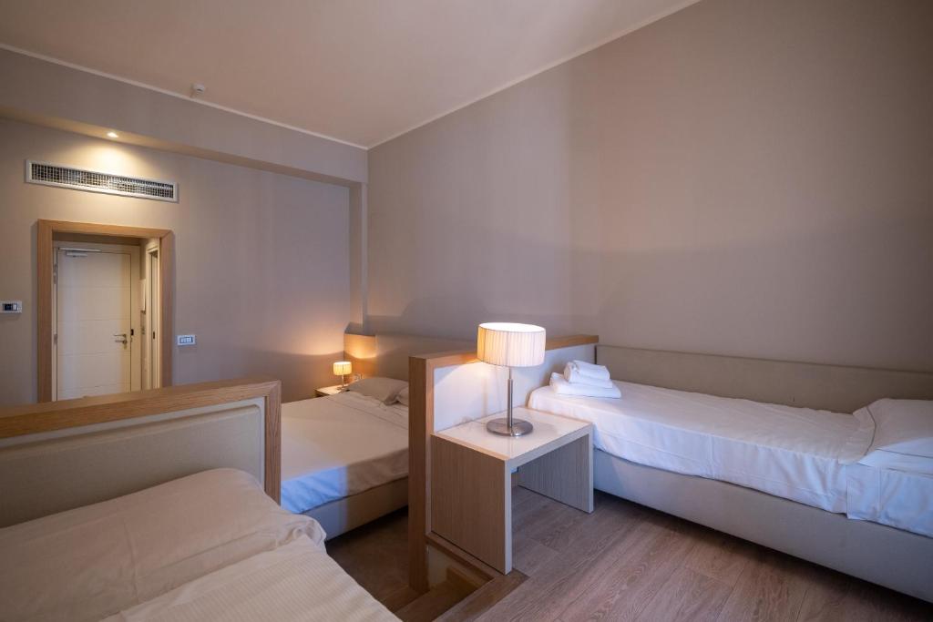 Postel nebo postele na pokoji v ubytování Hotel Calabona