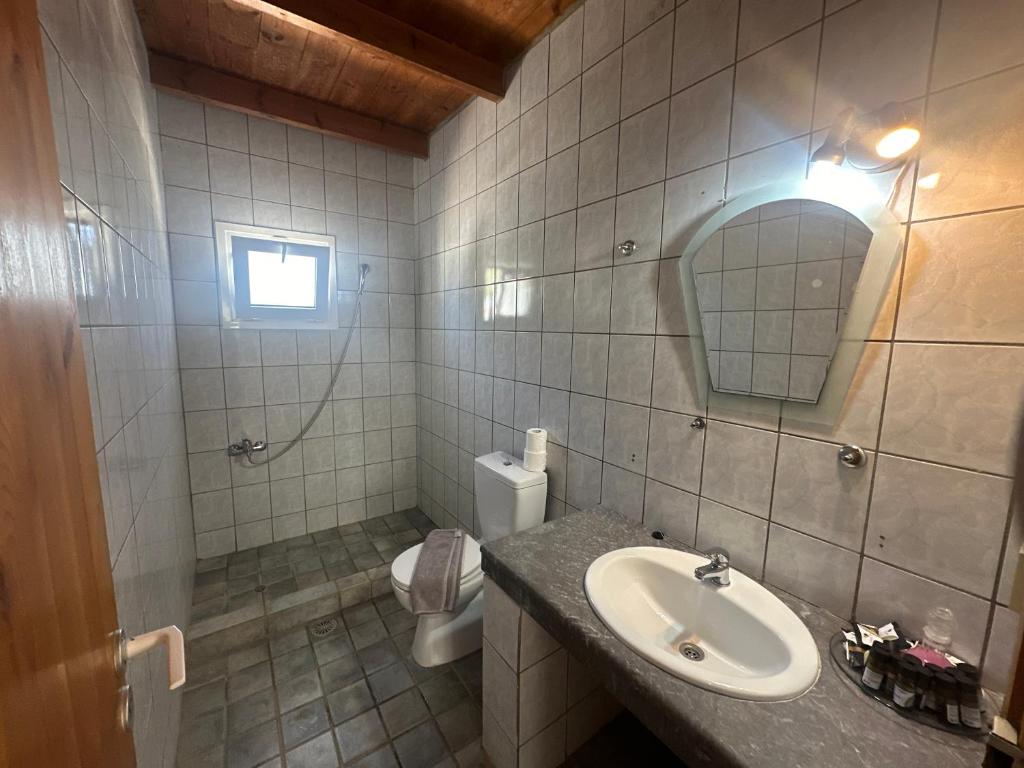 Koupelna v ubytování Galini Tropica